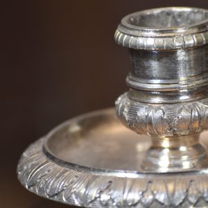 Pormenor de candela com espevitador em prata. Século XIX.